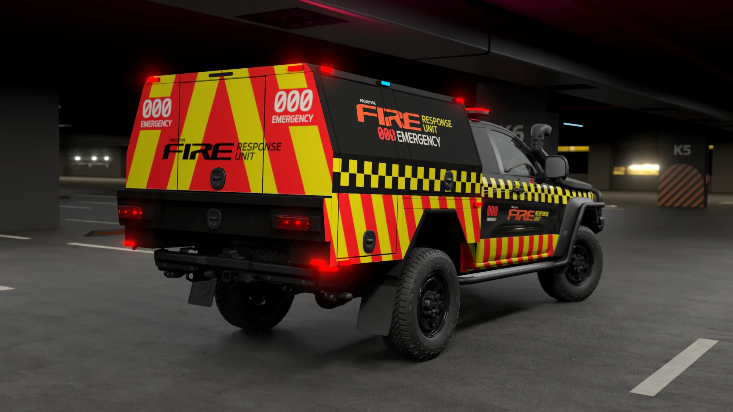 Rear three-quarter view of a Ford Ranger Super Duty fire response vehicle with high-visibility yellow and red checkered livery, parked in an underground garage at night with emergency lights illuminated