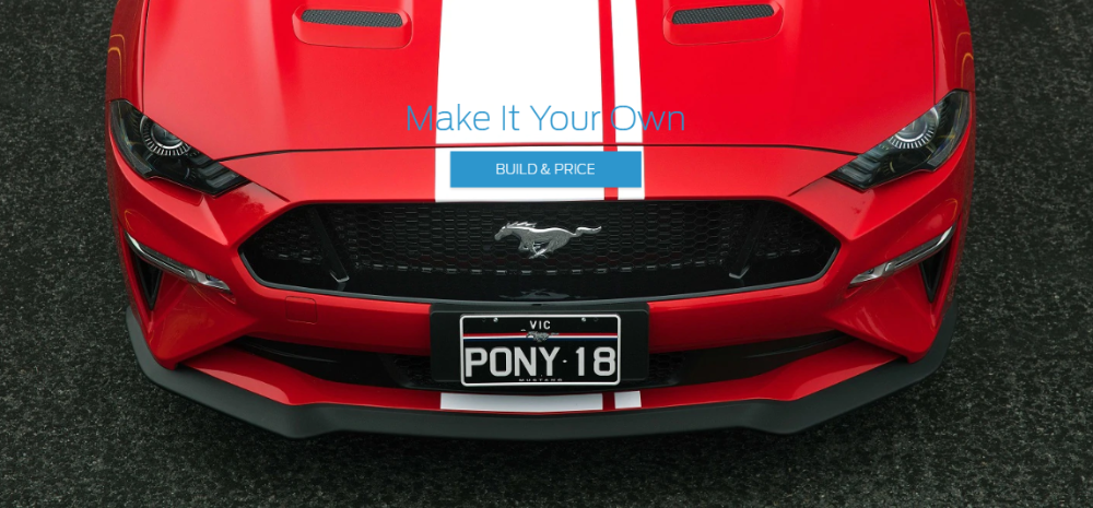 Red Ford Mustang viewed from above, featuring a custom Victorian license plate reading 'PONY:18' with white racing stripes, positioned on asphalt with 'Make it Your Own' and 'BUILD & PRICE' overlay text